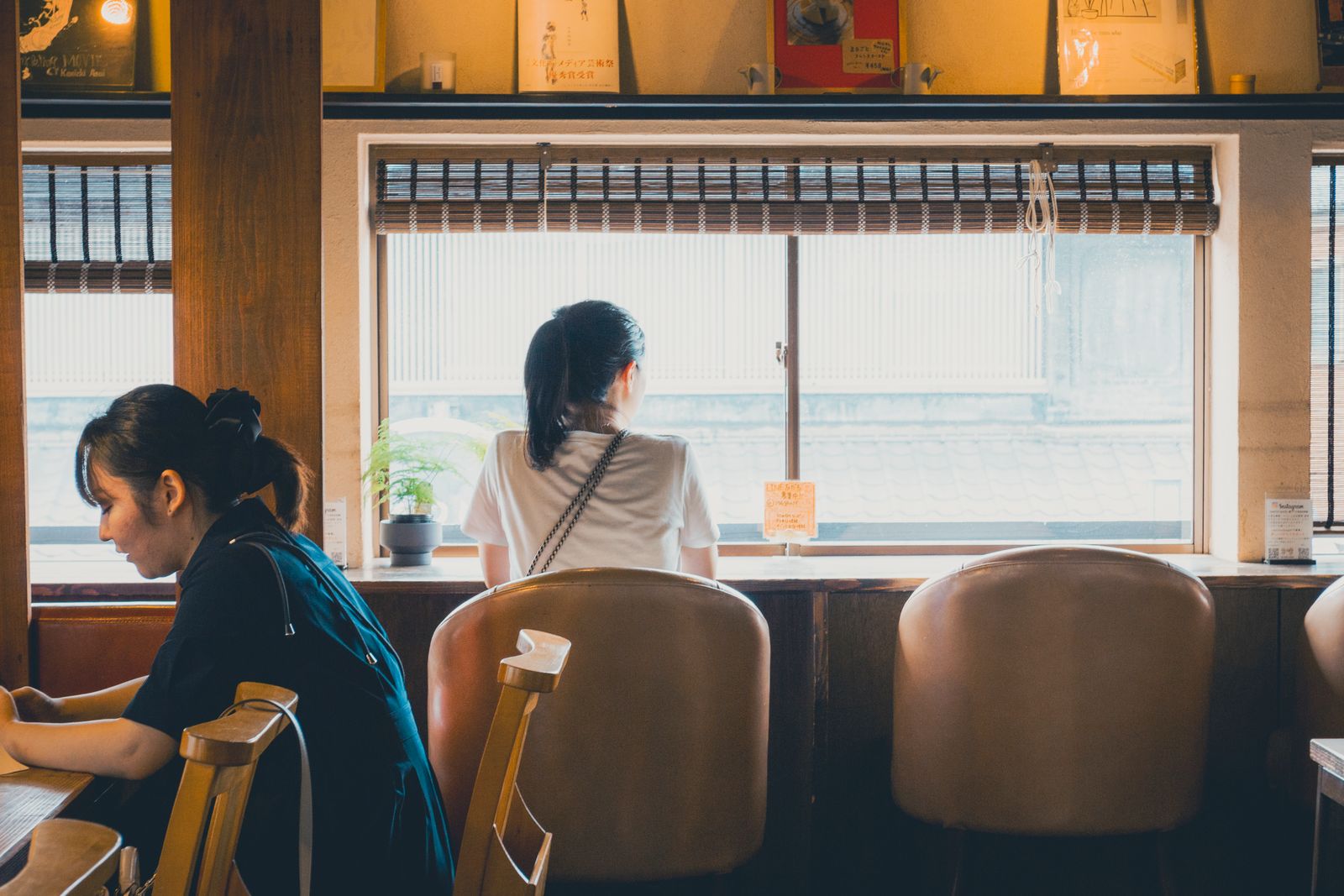 Inside a cozy, wood-toned Japanese kissaten coffee house
